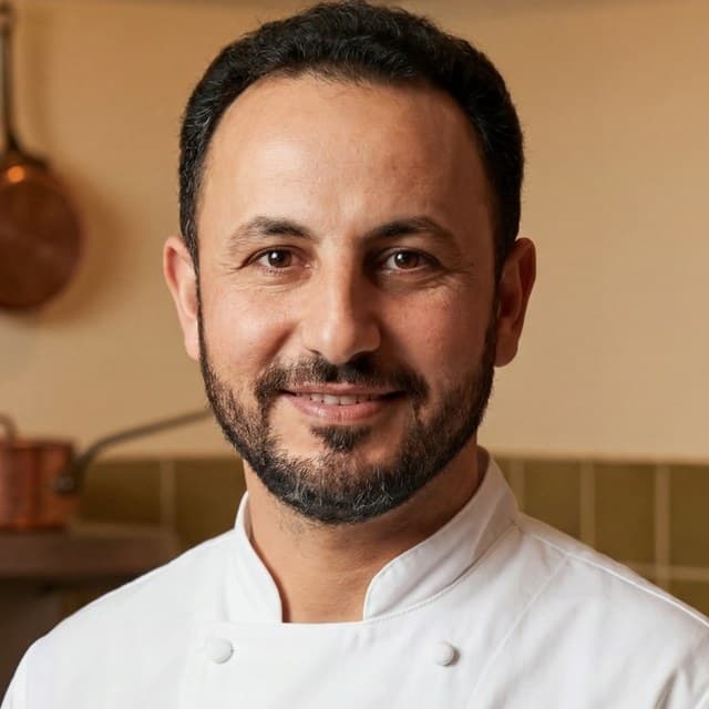Chef Sultan — Sinan Camozu — in the kitchen at 133 6th Street